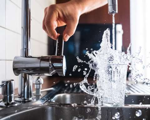 person opening faucet