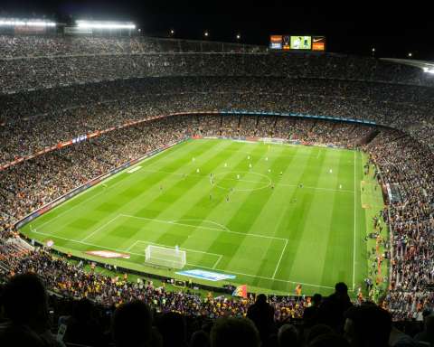 people watching soccer game in stadium