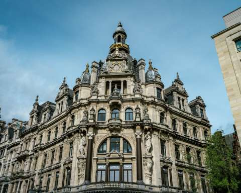 a large building with a clock on the top of it