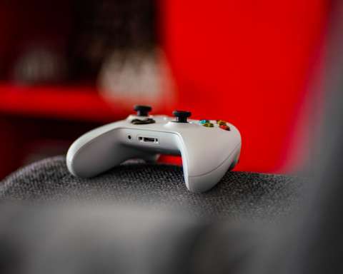 shallow focus photo of white Microsoft Xbox wireless game controller